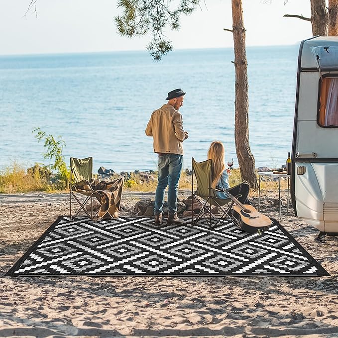 GENIMO Outdoor Rug for Patio Clearance, 6'x9' Waterproof Camping Mat, Reversible Plastic Straw Rugs for RV, Camper, Balcony, Backyard, Picnic, Deck (Mix Black White)